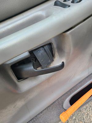 Photo showing that when I arrived to pick up my SUV, my interior driver's door handle was locked in an abnormal position and wouldn't close.