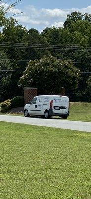 Parking on neighbor's grass (not the customer).