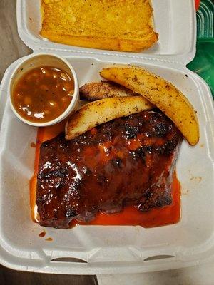 Half slab rib dinner with Greek potatoes,  baked beans & garlic bread.