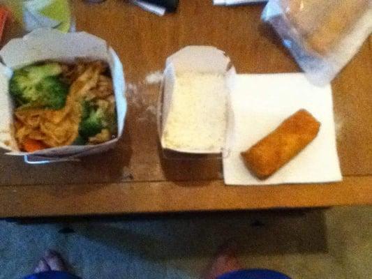 Chicken and broccoli with white rice and an egg roll to-go.