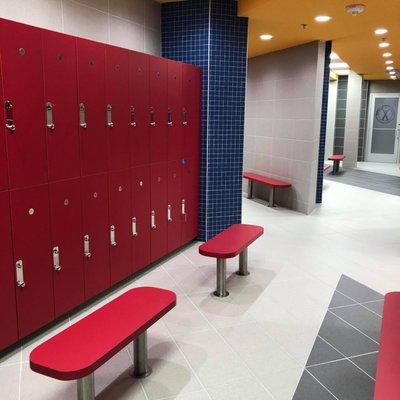 Pristine locker rooms with dry sauna, showers, and lounge areas.