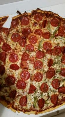 Cheese and pepperoni pizza half green pepper