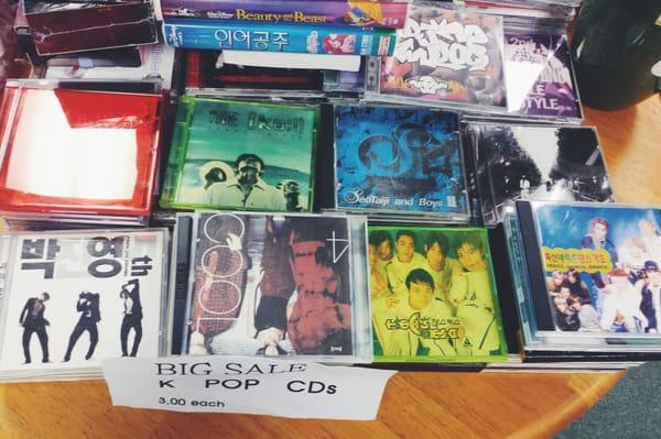 Kpop clearance! Go relive the 90s. These are located on a table near the entrance.