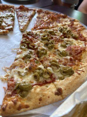 Cheese pizza and green olive pizza