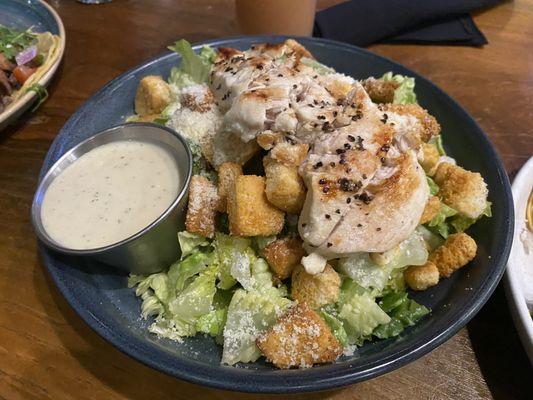 Chicken Caesar salad. Chicken is added cost.