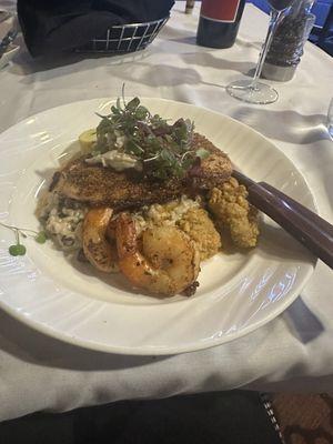 Snapper Ponchartrain with Parmesan mushroom rice, shrimp, crab meat & oysters.