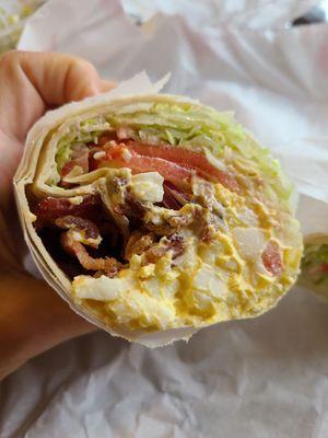 Egg salad, bacon, lettuce, tomato wrap