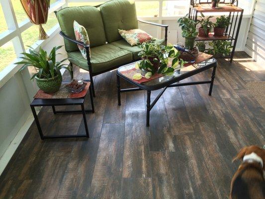 By using a wood look tile we helped our client create in inviting look for their lanai.