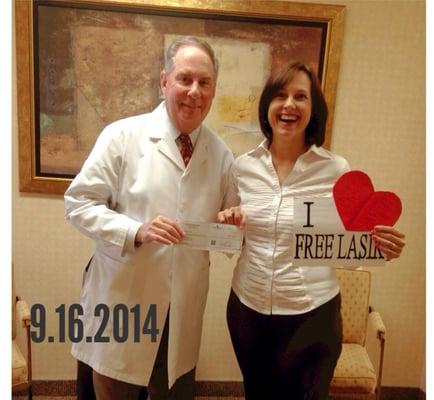 One of our 1 in 40 FREE LASIK Winners celebrating with Dr. Gladsden