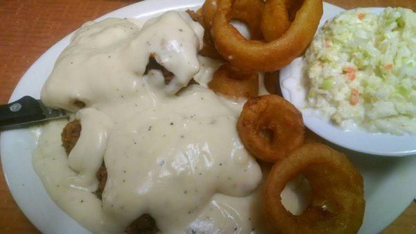 Chicken fried steak with onion rings and coleslaw... Yum it was delicious... The fried mushrooms were yummy too