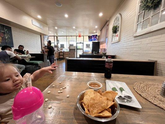 Chips and Salsa Inside eating area, but they also have a cute outdoor eating area as well.