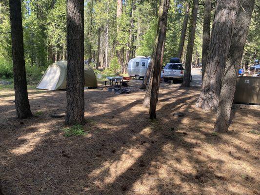 Walking back to our campsite, the tiny trailer and tent had lots of space, but the truck barely fit behind the painted white line