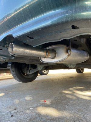 New muffler in place (not visible: tack-welded repairs to the heat shield)