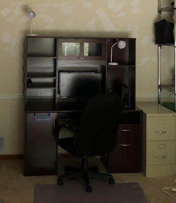 This desk was moved just fine without being taken apart by only two of the movers! Wow!