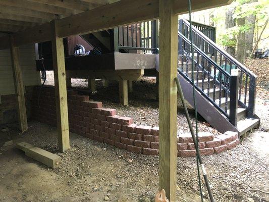 Custom retaining wall on the underside of the deck.