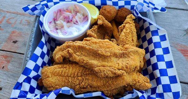 4 piece catfish with slaw, fries, and hushpuppies. Delicious!!