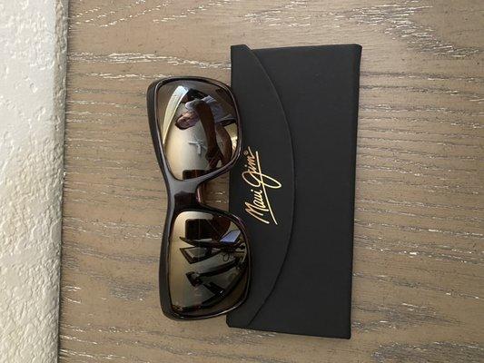 Maui Jim sunglasses and collapsible case.