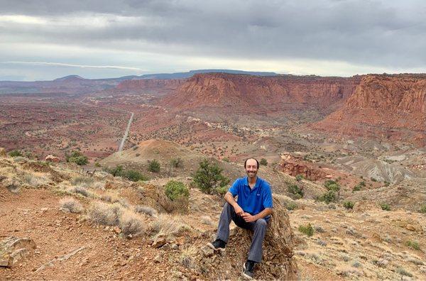 Taking a seat for a photo with a stunning background!