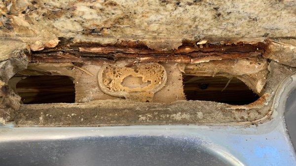 Once faucet was removed, the granite was totally loose and could be removed.