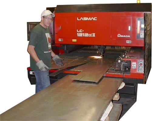 Our Amada 2500 Watt laser busy finishing a run.