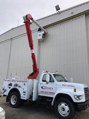 We have the equipment to go anywhere. Here, our boom truck lifts our guys to get to bird nests that are a problem at Columbus Metro airport