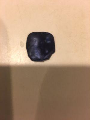 Found this on my pizza with black olives. In case you can't tell it is a false finger nail with dark blue sparkly nail polish on it.