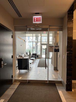 Secured mail room and elevator lobby facing main lobby area