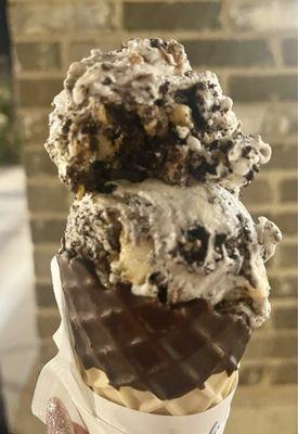 Cheesecake with Oreo in a chocolate dipped waffle cone