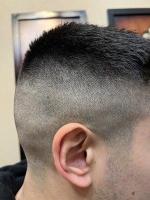 The managers attempt to fix his fade.  The top was horribly uneven too.