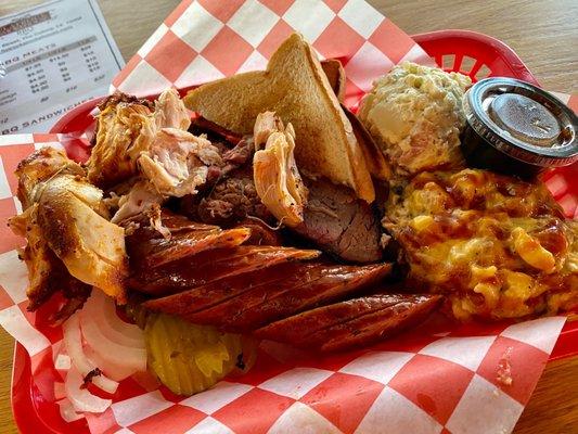 1/2 lb. Brisket, 1/4 lb. chicken, 1/4 lb. sausage, potato salad (small), brisket Mac & cheese (small)