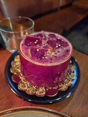 Smoky mezcal, beet cocktail with gold stars in it!