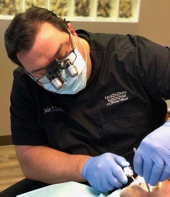 Atlanta dentist Exceptional Dentistry at Johns Creek Judson T. Connell, DMD at work in his operatory