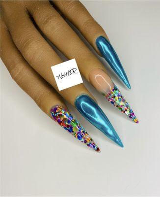 Extreme long ecapsulated acrylic nails with chrome.