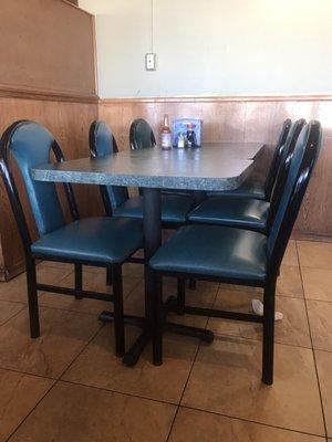 Outdated restaurant. Dirty floors, chairs and tables.