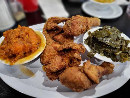 Fried chicken with collard greens and yams.