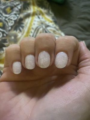 Sparkly white dip powder. So thin you can see the whites of my nail tips but so strong!