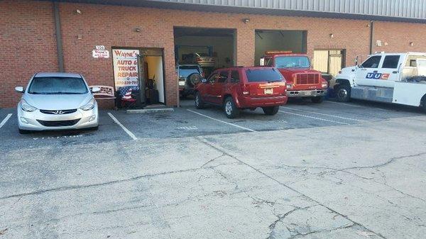 Our shops located right before the stop sign on the right. We have a sign by the tree advertising our business