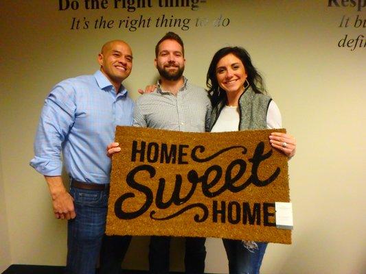 Loan Officer Jed Manuel is seen here with a couple who just signed the papers on their new house!