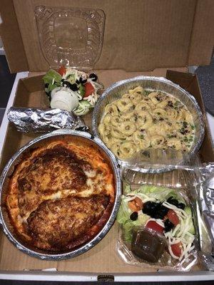 I got chicken parmesan and their pea and bacon Alfredo tortellini with side salads and garlic bread.