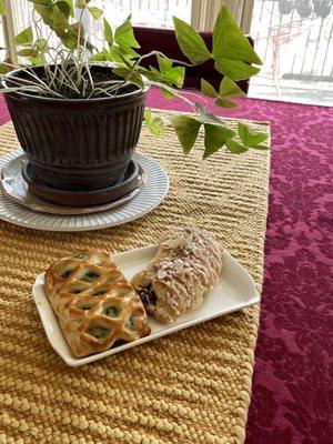 Bear claw and a feta cheese pastry delectable