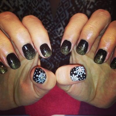 Gel hand painted snowflake nails done by Melissa Glen