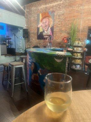 Photo of the bar, interesting art, front window and, obvi, a lil vino--awesome vibes!