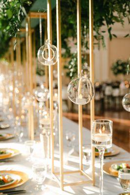 Estate table flowers and candles and reception table centerpieces by UFE. Photo by Leigh Wolfe Photography. Venue: Atlanta History Center.