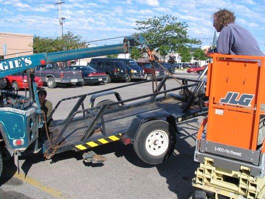 Moments before the wheel on the far side fell completely off. We ended up tossing it into the bed of the trailer before getting on the road.