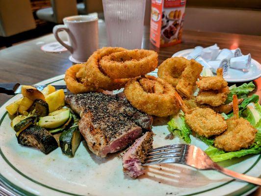 Surf n turf lol it's NY steak w/ butterfly shrimp and onion rings instead of carby potato.