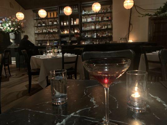 View of the dining room and a Black Manhattan cocktail