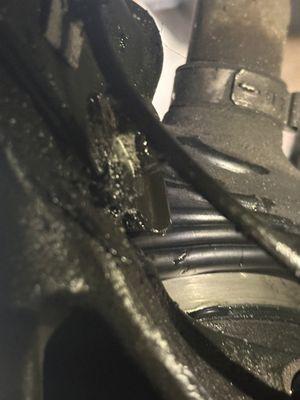 Damaged boot and mark that perfectly aligns with shock mount.