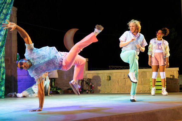 Dane Parker doing a bit of gymnastics as Demetrius while Helenus and Lysandra watch on (Steve Rogers)