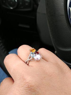 The one and only, which includes the topaz I provided. The design is very similar to my engagement and wedding rings