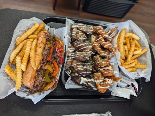 Oxtail Philly 6 jerk wings 6 honey siracha wings and an order of fries.